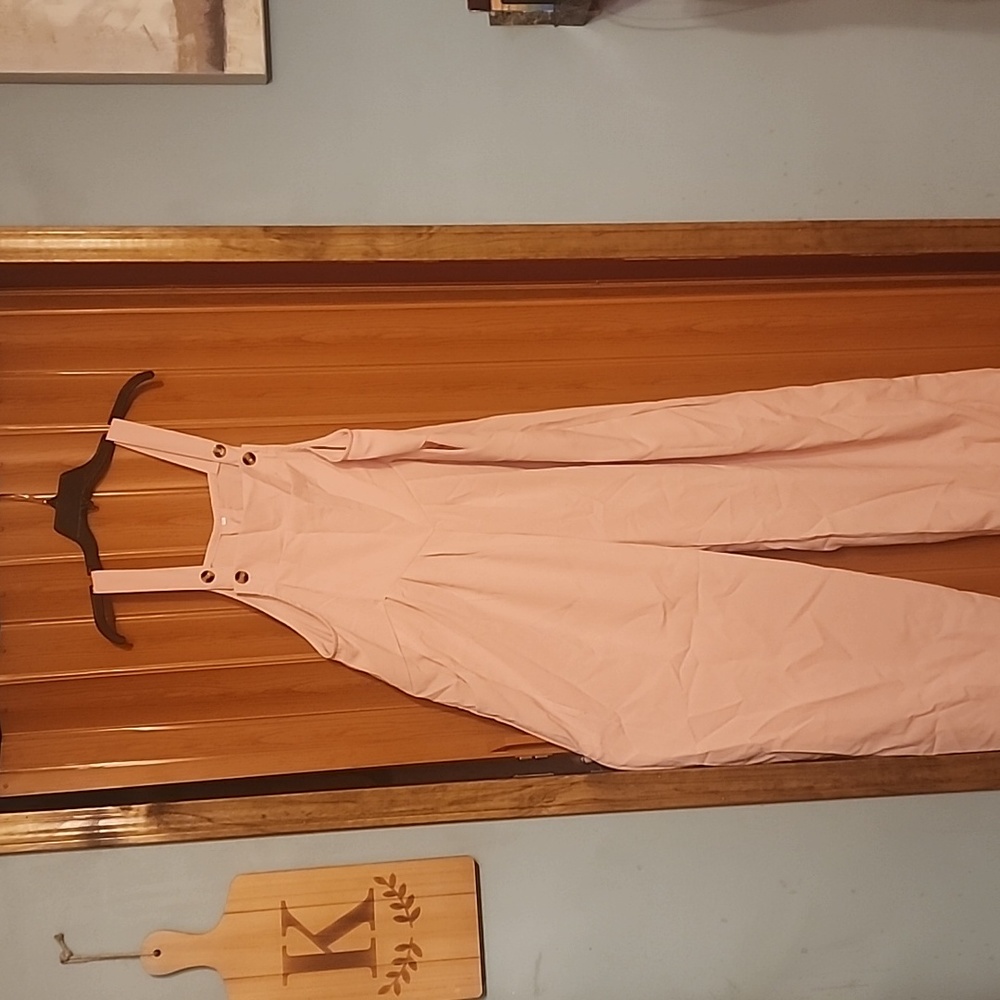 Soft pink jumpsuit.